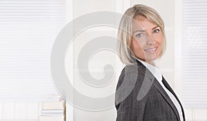 Portrait: Beautiful middle aged isolated businesswoman.