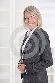 Portrait: Beautiful middle aged isolated businesswoman.