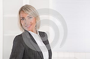 Portrait: Beautiful middle aged isolated businesswoman.