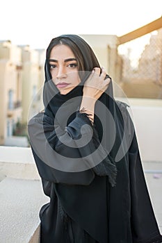 Portrait of beautiful middle eastern young woman wearing tradition arabic clothing outdoors