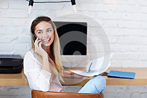 Portrait of beautiful millennial woman working in modern home office