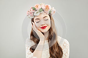 Portrait of Beautiful Model Girl with Clear Hair, Natural Makeup and Flowers on White Background