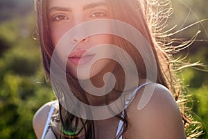 Portrait of beautiful model with natural nude make up. Beauty girl face. Young sensual woman outdoors portrait. Soft