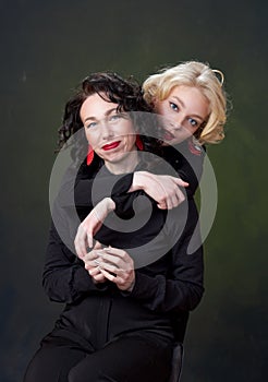 Portrait of beautiful mother daughter possing in a studio