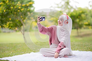 Portrait of a beautiful muslim woman at park