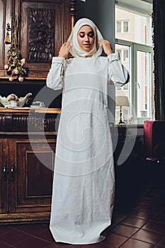 portrait of a beautiful Muslim woman in traditional Islamic clothing and cover their heads.