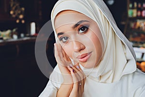 portrait of a beautiful Muslim woman in traditional Islamic clothing and cover their heads.