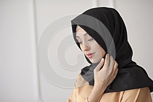 Portrait of a beautiful Muslim woman in traditional Islamic clothing and cover their heads