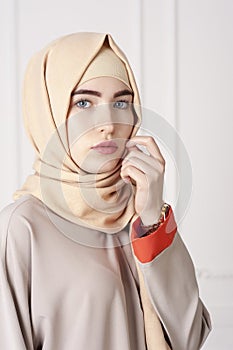 Portrait of a beautiful Muslim woman in traditional Islamic clothing and cover their heads