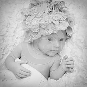 Portrait of a beautiful newborn girl with Down syndrome