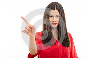 Portrait of beautiful nurse wearing red scrubs showing denial gesture