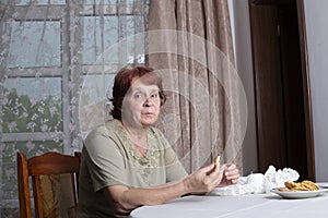 Portrait of a beautiful old woman at home