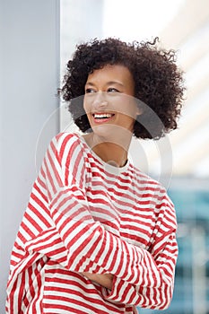 Beautiful older woman standing outside in city and smiling