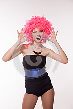 Portrait of beautiful party girl in pink wig