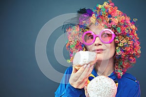 Portrait of beautiful party woman in wig and glasses Carneval