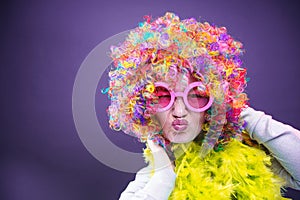 Portrait of beautiful party woman in wig and glasses Carneval