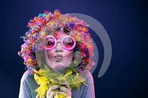 Portrait of beautiful party woman in wig and glasses Carneval