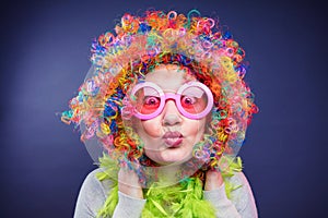 Portrait of beautiful party woman in wig and glasses Carneval