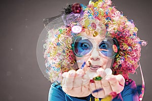 Portrait of beautiful party woman in wig and glasses Carneval