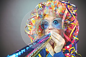 Portrait of beautiful party woman in wig and glasses Carneval