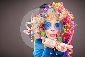 Portrait of beautiful party woman in wig and glasses Carneval