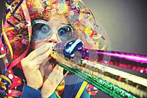 Portrait of beautiful party woman in wig and glasses Carneval