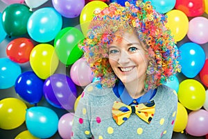 Portrait of beautiful party woman in wig and glasses Carneval