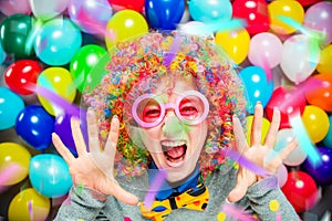 Portrait of beautiful party woman in wig and glasses Carneval