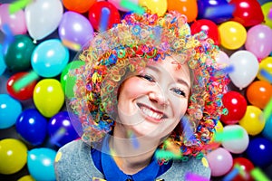 Portrait of beautiful party woman in wig and glasses Carneval