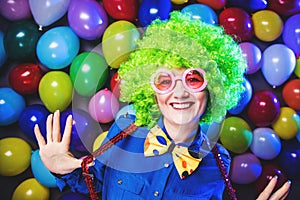 Portrait of beautiful party woman in wig and glasses Carneval