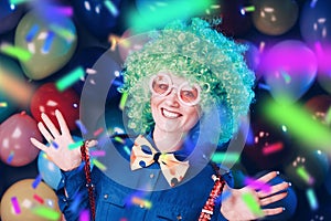 Portrait of beautiful party woman in wig and glasses Carneval