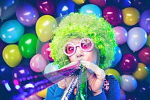 Portrait of beautiful party woman in wig and glasses Carneval