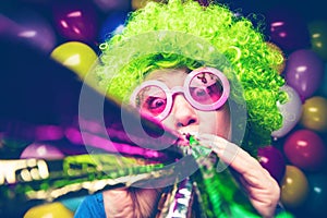 Portrait of beautiful party woman in wig and glasses Carneval