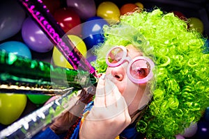 Portrait of beautiful party woman in wig and glasses Carneval