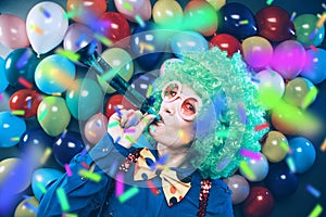 Portrait of beautiful party woman in wig and glasses Carneval