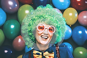 Portrait of beautiful party woman in wig and glasses Carneval