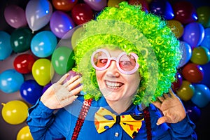 Portrait of beautiful party woman in wig and glasses Carneval