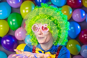 Portrait of beautiful party woman in wig and glasses Carneval