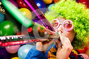 Portrait of beautiful party woman in wig and glasses Carneval