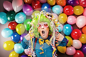 Portrait of beautiful party woman in wig and glasses Carneval