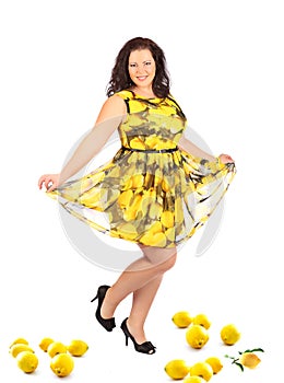 Portrait of beautiful plus size young brunette woman posing on white background