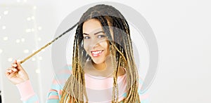 Portrait of beautiful positive african american black woman standing and spinning hair Copy space