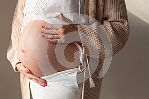 Portrait of beautiful pregnant woman home before childbirth