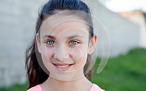 Portrait of a beautiful preteen girl with blue eyes