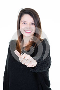 Portrait of a beautiful pretty girl with thumb up gesture