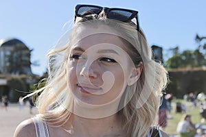 portrait of a beautiful pretty young woman under the sun