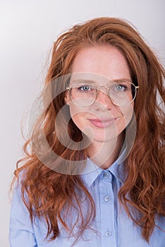 Portrait of beautiful, red-haired woman with glasses