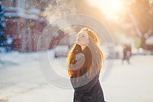 Portrait beautiful redhair girl in frosty winter weather. photo