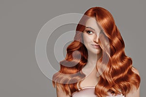 Portrait of beautiful redhair young woman. Wavy hairstyle