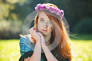 Portrait of a beautiful redheaded freckled woman
